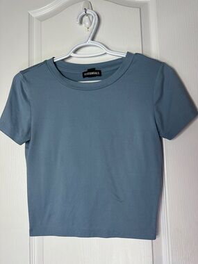 ESSENTIALS Women's Dusty Blue Crop Crewneck Tee ptp 16” length 18.5” cap sleeve